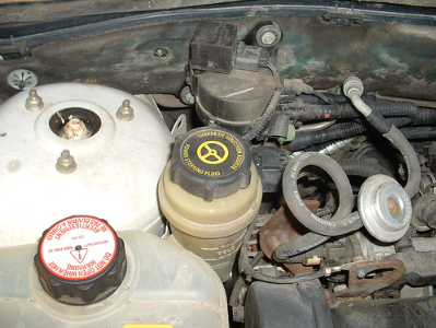 Toyota power steering fluid under the hood.