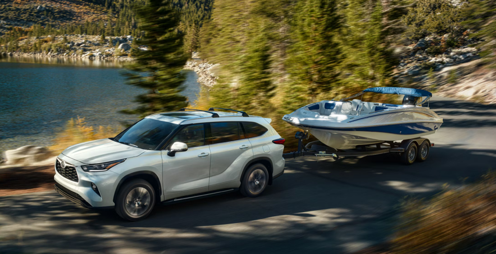 2026 Toyota Highlander driving on scenic road