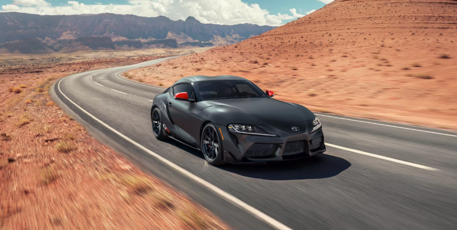 Toyota GR Supra driving on desert highway